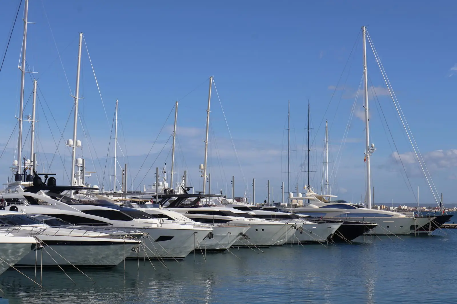 Luxury high-value yachts moored in the port of Palma de Mallorca representing extensive yacht insurance services.