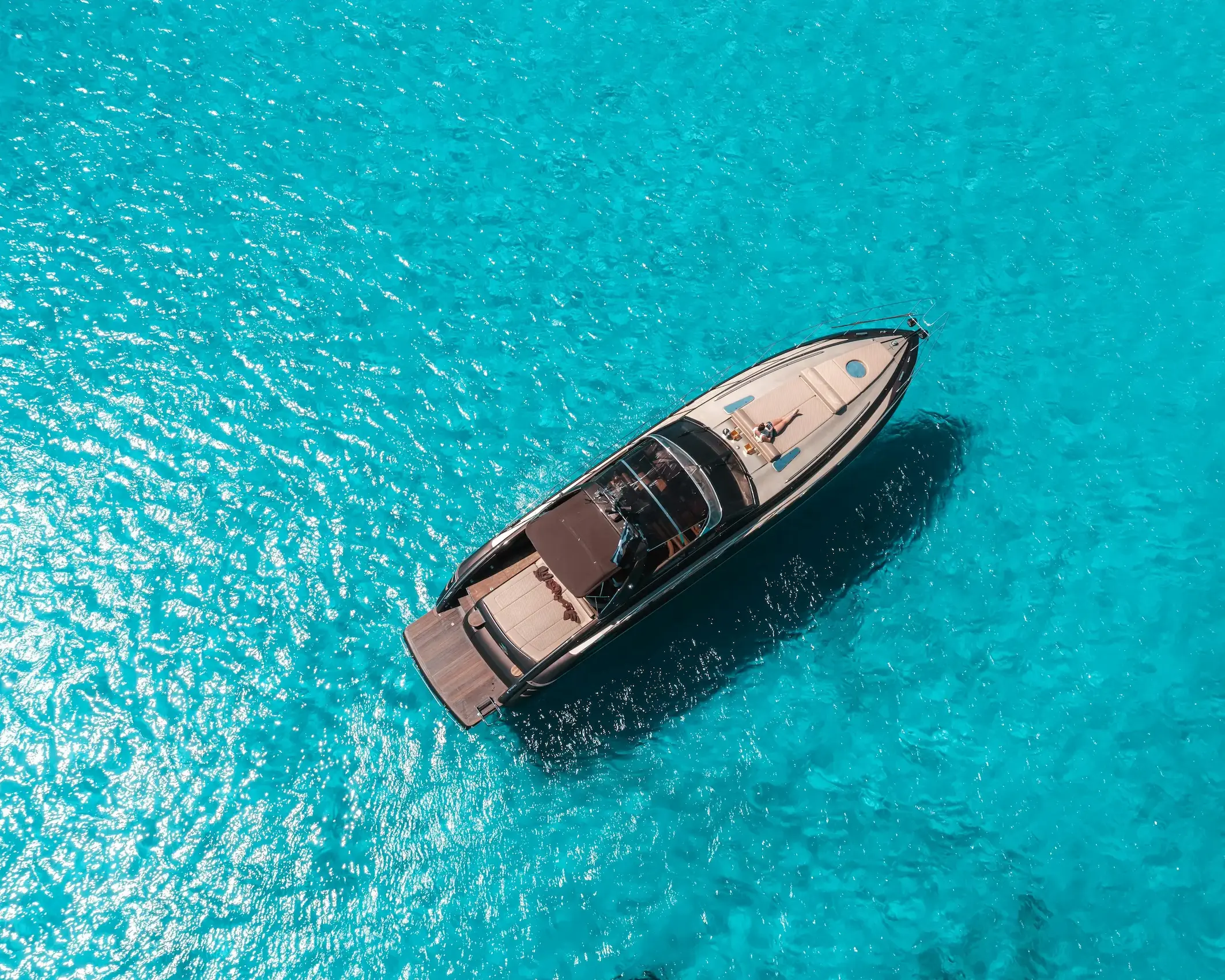 Aerial view of a luxury yacht in Mallorca; providing exclusive marine insurance and P&I coverage for private and charter boats in Mallorca and the Balearic Islands.